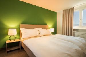 Le Domaine (Swiss Lodge)客房内的一张或多张床位