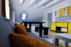 a living room with a couch and a table at Cityap Apartments in Martinske Hole
