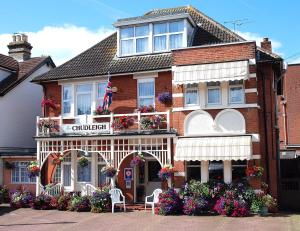 a building with flowers in front of it at The Chudleigh in Clacton-on-Sea