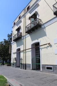 a building with two balconies on the side of it at Hotel Il Santuario - Pompei in Pompei