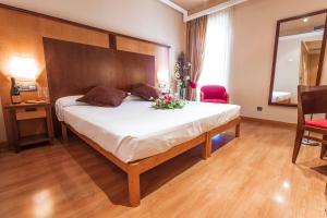Postel nebo postele na pokoji v ubytování Hotel Bardo Recoletos Coco