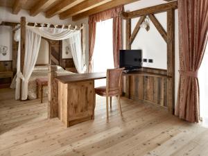 TV a/nebo společenská místnost v ubytování Agriturismo Ai Castioni
