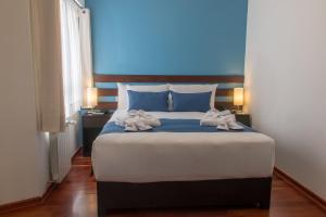 Postel nebo postele na pokoji v ubytování Wayqey Hotel