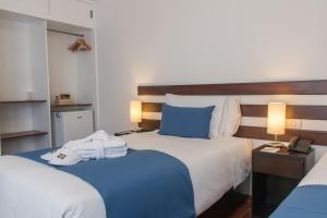 Postel nebo postele na pokoji v ubytování Wayqey Hotel
