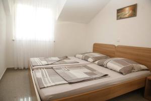 Postel nebo postele na pokoji v ubytování Apartments Šimić