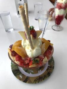 a fruit salad in a bowl on a table at Hotel Sol Puntarenas in Puntarenas