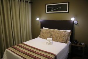 Postel nebo postele na pokoji v ubytování Ideali Hotel