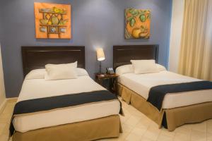 Katil atau katil-katil dalam bilik di Hotel Presidente Las Tablas
