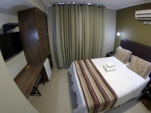 Postel nebo postele na pokoji v ubytování Ideali Hotel