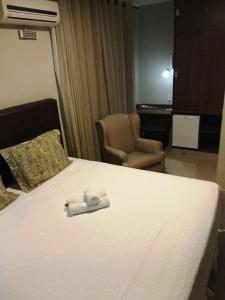 Postel nebo postele na pokoji v ubytování Ideali Hotel