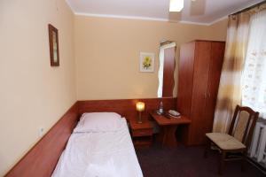 Postel nebo postele na pokoji v ubytování Hotel Kakadu