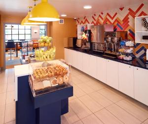 a store with a counter with food on it at LivINN Hotel Minneapolis South / Burnsville in Burnsville +16 photos
