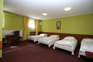 Postel nebo postele na pokoji v ubytování Hotel Kakadu