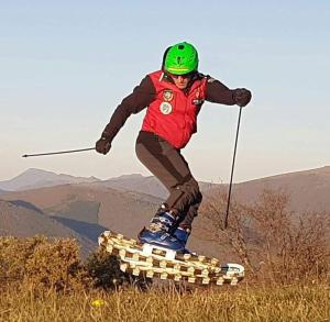 a man riding a skateboard on top of a hill at B&B Casa Zia Cianetta Residenza di Campagna in Capodacqua di Foligno