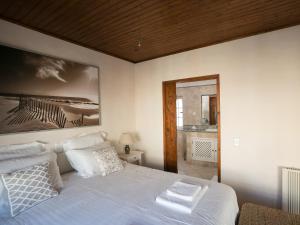 En eller flere senge i et værelse på Carvoeiro Beach Duplex