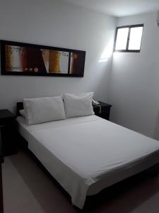 Postel nebo postele na pokoji v ubytování Hotel Central