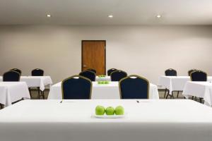 a conference room with white tables and chairs at Country Inn & Suites by Radisson, Houston Northwest, TX in Houston