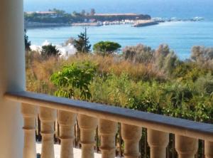 a balcony with a view of the ocean at Pomos Harbourbiew Villa in Pomos