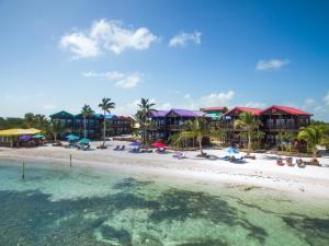 an aerial view of a beach with houses and the water at X'tan Ha- The Waterfront in San Pedro