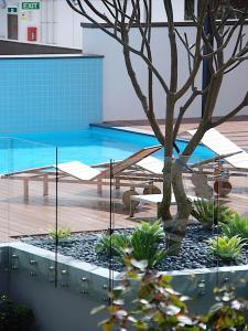 The swimming pool at or near Claremont Quarter Luxury Apartment