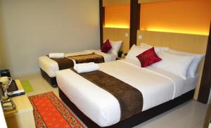 Postel nebo postele na pokoji v ubytování City Central Hotel
