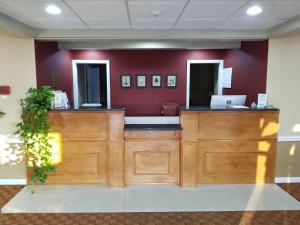 a waiting area in a hospital with a laptop at All Seasons Inn & Suites in Bourne