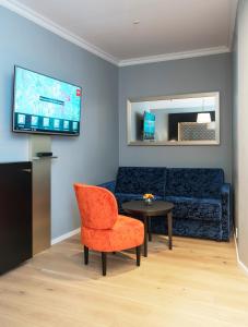 TV a/nebo společenská místnost v ubytování Thon Hotel Spectrum