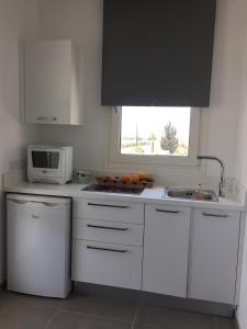 Kuchyň nebo kuchyňský kout v ubytování Casa Vacanze Baciata