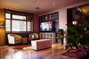 Telewizja i/lub zestaw kina domowego w obiekcie Hotel Salzburg