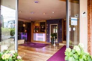 an entrance to a building with purple floors and glass doors at Hotel Salzburg in Salzburg