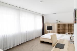 Ένα ή περισσότερα κρεβάτια σε δωμάτιο στο Hotel Stadt Tuttlingen