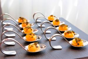 a group of plates of food on a table at Centennial Nexus Hotel Tallinn in Tallinn