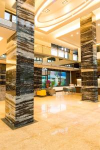 a lobby with two large columns in a building at V-Hotel in Taitung City