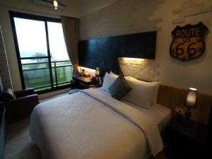 Postel nebo postele na pokoji v ubytování Kenting Moon Bay Hotel
