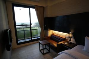 Postel nebo postele na pokoji v ubytování Kenting Moon Bay Hotel