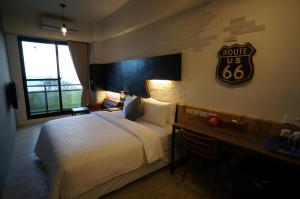 Postel nebo postele na pokoji v ubytování Kenting Moon Bay Hotel