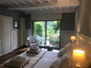 a living room filled with furniture and a window at B&B Number 11 Exclusive Guesthouse in Bruges
