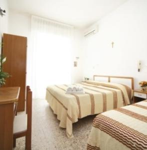 Postel nebo postele na pokoji v ubytování Guestrooms Ross