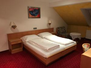 Letto o letti in una camera di Gasthof "Zur Kanne"