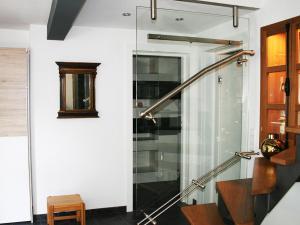 a shower in a room with a glass door at Ferienwohnung Tannenweg in Baden-Baden
