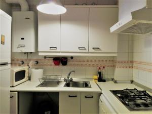 Kuchyň nebo kuchyňský kout v ubytování Duplex En Corral De Vecinos San Bernardo + 26 fotografií