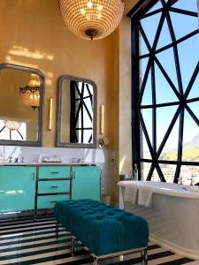 
a room with a large window and a bench at The Silo Hotel in Cape Town
