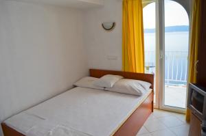 Posteľ alebo postele v izbe v ubytovaní Apartments Panorama