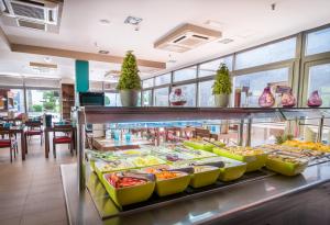 a buffet in a restaurant with many different foods at Hotel LIVVO Corralejo Beach in Corralejo