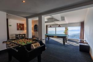 a billiard room with a pool table and a pool table at LAM Hotel dos Carqueijais in Covilhã