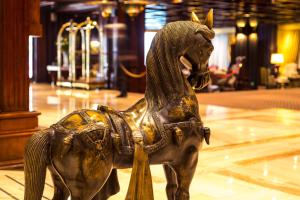 a statue of a horse on display in a building at Hotel Plaza San Francisco in Santiago