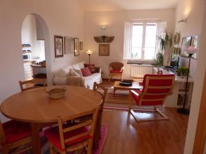 a living room with a table and chairs at Garden Lodge in Chiavari