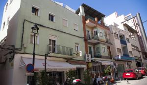 a group of buildings on a city street at Hospedaje Lisboa Algeciras in Algeciras