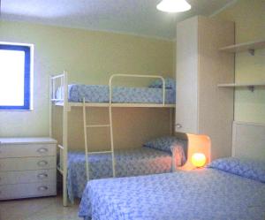 Postel nebo postele na pokoji v ubytování Residence Il Turistico + 37 fotografií