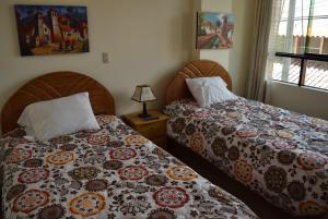 Cama o camas de una habitación en Kuski Hospedaje